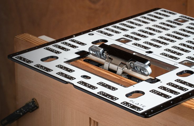 Shaper Plate in use on a cabinet, positioning a hinge cutout